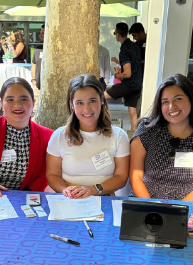 Marisol Ibarra sitting at an event table