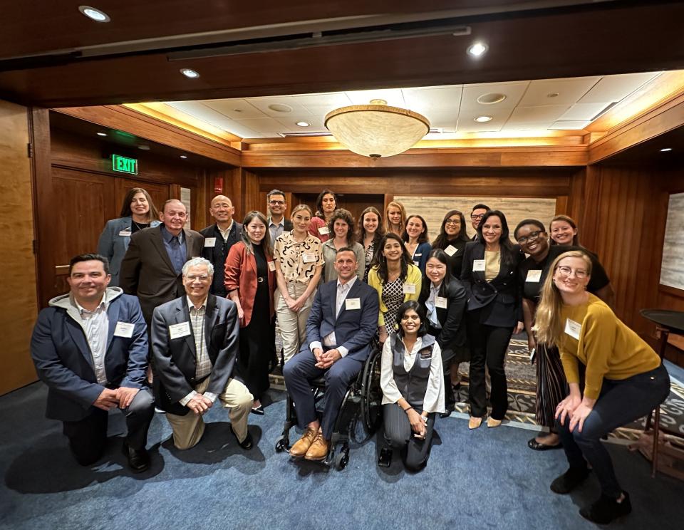 MBA students gather around Keynote Speaker Derek Herrera