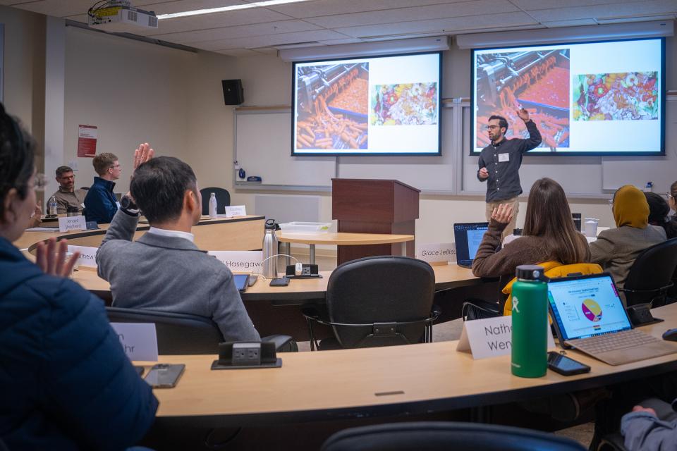 Dan Kurzrock talking to students in classroom