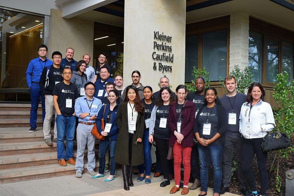 KPCB Ignite attendees pose for a group photo in front of a building